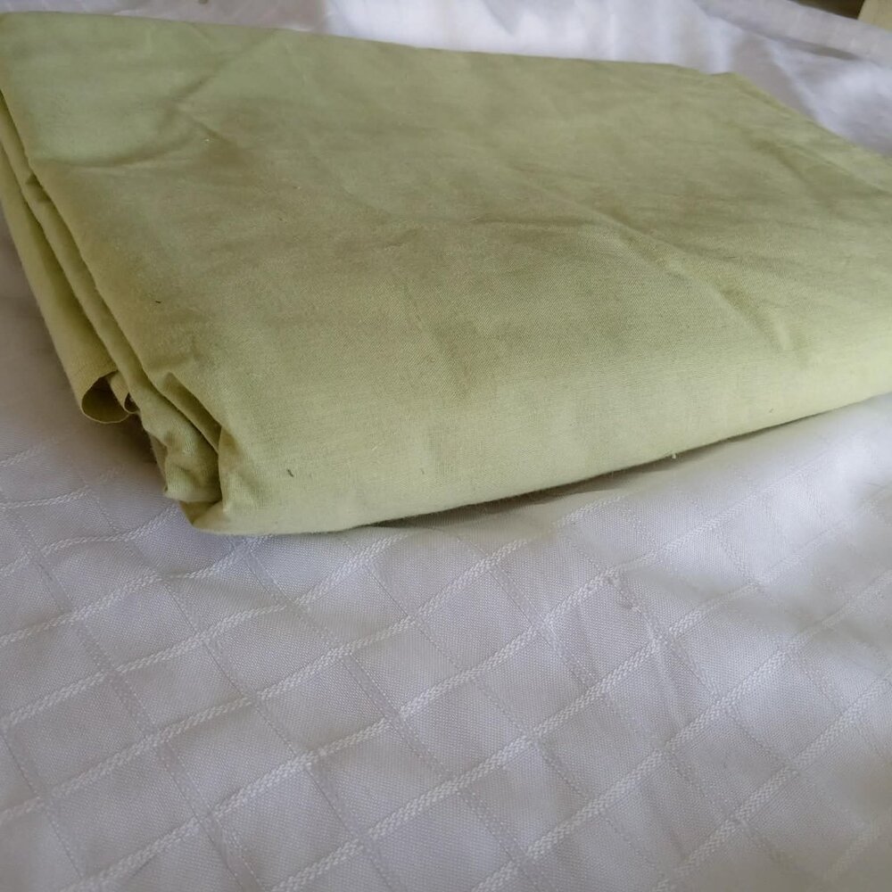 Really big piece of fabric pale green 100% cotton. Dimensions: 110 x 110 inches.